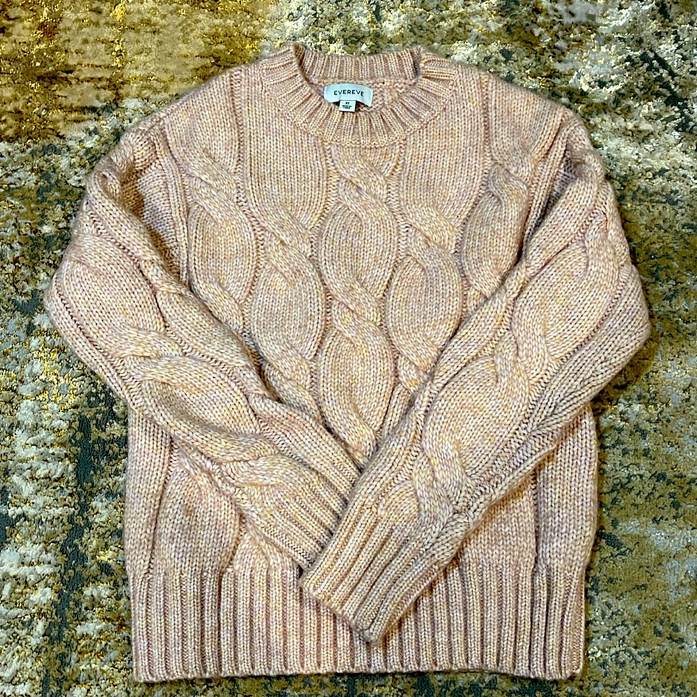 Warm cozy pink sweater with golden undertones